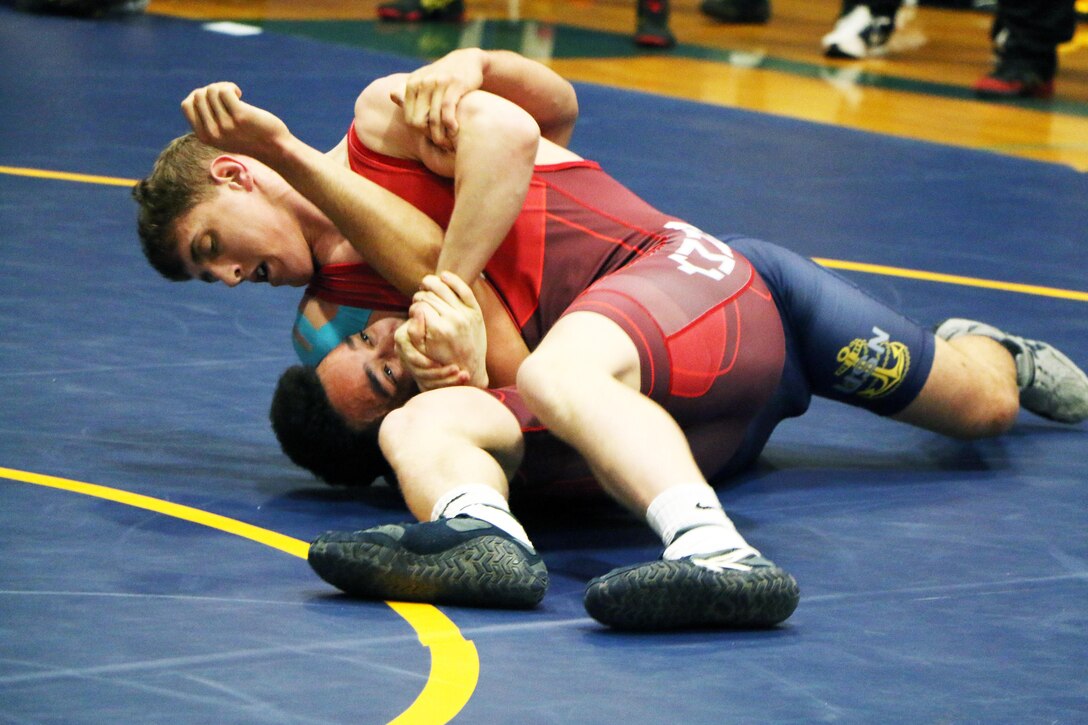 Army Pfc. Michael Hooker of Fort Carson, Colo pins Navy Petty Officer 2nd Class Whit Dawkins of Whidbey Island, Wash. in 2:41 of the first period on his way to Armed Forces Gold in the 66kg Greco-Roman competition of the 2016 Armed Forces Wrestling Championship, part of the #Road2IowaCity series.  The Armed Forces Greco-Roman Championship serves as a qualifying event for the USA Wrestling Olympic Trials held in Iowa City, Iowa from 8-10 April. 