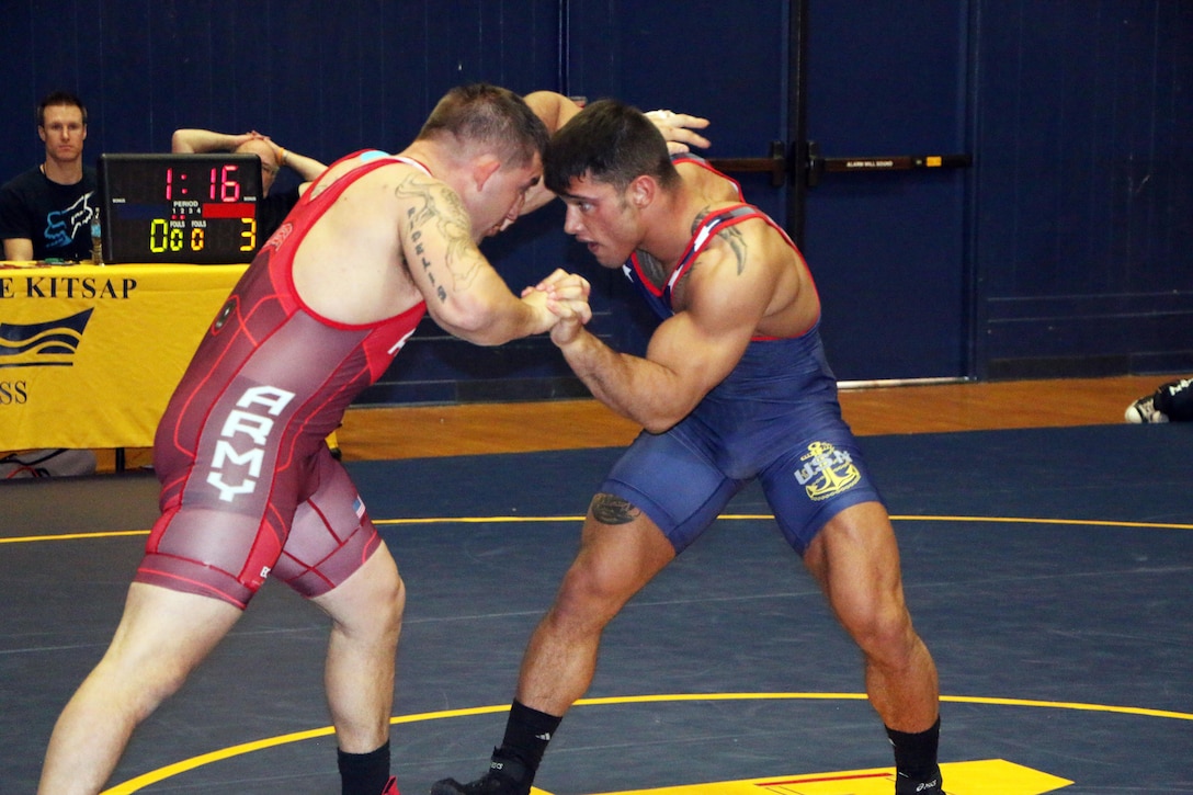 Army Sgt. Courtney Meyers (red) of Fort Carson, Colo. defeats Navy Petty Officer 3rd Class James Souza (blue) of the USS America in the 85kg Greco-Roman competition of the 2016 Armed Forces Wrestling Championship, part of the #Road2IowaCity series.  Meyers would take gold and Souza silver in the competition.  The Armed Forces Greco-Roman Championship serves as a qualifying event for the USA Wrestling Olympic Trials held in Iowa City, Iowa from 8-10 April. 