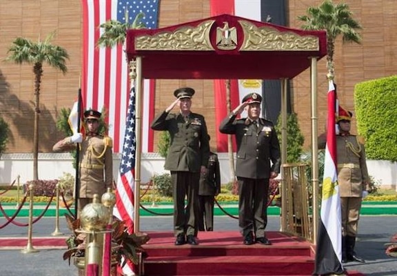 Marine Corps Gen. Joseph F. Dunford Jr., chairman of the Joint Chiefs of Staff, and Egyptian Chief of the Armed Forces Lt. Gen. Mahmoud Hegazy, right, render honors during an honor cordon at the Egyptian Ministry of Defense in Cairo, Feb. 20, 2016. (DoD photo by D. Myles Cullen)