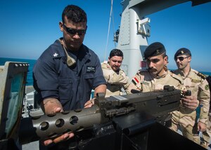 (Feb. 15, 2016) Gunner’s Mate 1st Class Christopher Lamotte, assigned to the Arliegh Burke-class guided-missile destroyer USS Russell (DDG 59), dismounts a .50 cal to demonstrate how to properly perform maintenance to Iraqi Navy Sailors assigned to Iraqi Swift Boat (P-308) during a Iraqi bilateral exercise. The U.S. participates in bilateral exercises with partner nations in order to build and strengthen solid partnerships throughout the region. Commander, Task Force 55 controls surfaces including U.S. Navy coastal patrol craft and U.S. Coast Guard patrols boats in the U.S. 5th Fleet area of operations. U.S. 5th Fleet continues to expand its relationship with the Iraqi navy through key leader engagements, professional exchanges, and conduct exercises to ensure success as a capable force able to defend its territorial waters in the Arabian Gulf.