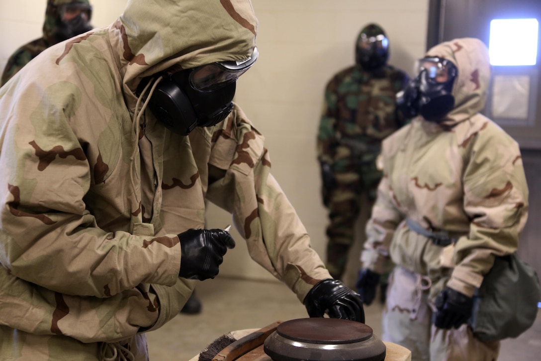 Cpl. Jeremy W. Case lights a hot plate to release CS gas during gas chamber training at Marine Corps Air Station Cherry Point, N.C., Feb. 10, 2016. Marines with Marine Aviation Logistics Squadron 14 faced the CS gas as part of their qualification to familiarize themselves with the equipment and skills if faced with a biochemical attack. Marines of every military occupational specialty must be proficient with the equipment as it is part of every Marines’ basic skills. Case is a Chemical, Biological, Radiologicl and Nuclear defense specialist with Marine Wing Headquarters Squadron 2. (U.S. Marine Corps photo by Cpl. N.W. Huertas/Released)