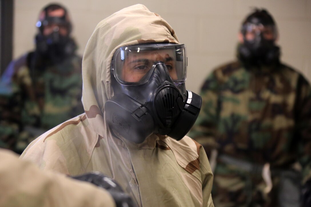 Cpl. Alyson Conchar gives Marines with Marine Aviation Logistics Squadron 14 instructions during gas chamber training at Marine Corps Air Station Cherry Point, N.C., Feb. 10, 2016. Marines in the gas chamber faced the CS gas as part of their qualification to familiarize themselves with the equipment and skills if faced with a biochemical attack. Marines of every military occupational specialty must be proficient with the equipment as it is part of every Marines’ basic skills. Conchar is a Chemical, Biological, Radiologicl and Nuclear defense specialist. (U.S. Marine Corps photo by Cpl. N.W. Huertas/Released)