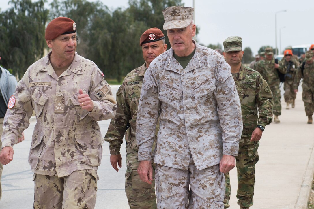 Marine Corps Gen. Joseph F. Dunford Jr., chairman of the Joint Chiefs of Staff, and Canadian Maj. Gen. Denis Thompson, left, commander of Multinational Force and Observers, talk between meetings on the North Camp in the Sinai Peninsula of Egypt, Feb. 21, 2016. DoD photo by D. Myles Cullen