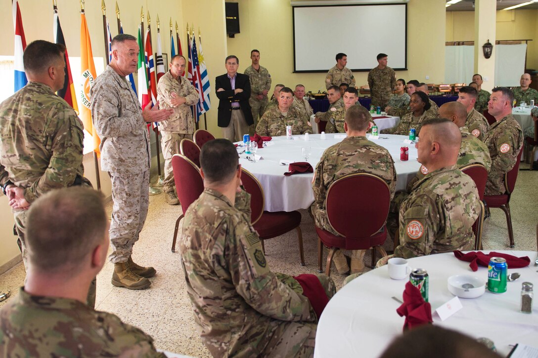 Marine Corps Gen. Joseph F. Dunford Jr., chairman of the Joint Chiefs of Staff, talks with service members assigned to the Multinational Force and Observers after joining them for lunch at the North Camp in the Sinai Peninsula of Egypt, Feb. 21, 2016. DoD photo by D. Myles Cullen 