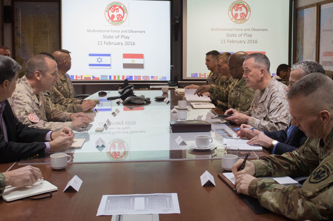 Marine Corps Gen. Joseph F. Dunford Jr., third right, chairman of the Joint Chiefs of Staff, receives a brief from Canadian Maj. Gen. Denis Thompson, second left, commander of Multinational Force and Observers, on the North Camp in the Sinai Peninsula of Egypt, Feb. 21, 2016. DoD photo by D. Myles Cullen