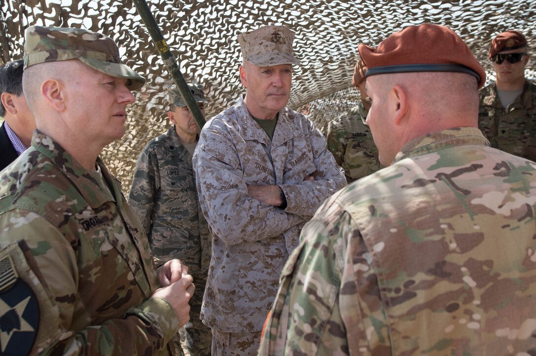 Army Command Sgt. Maj. John W. Troxell, left, senior enlisted advisor to the chairman of the Joint Chiefs of Staff, and Marine Corps Gen. Joseph F. Dunford Jr., center, chairman of the Joint Chiefs of Staff, listen to a brief during a visit to the North Camp in the Sinai Peninsula of Egypt, Feb. 21, 2016. DoD photo by D. Myles Cullen