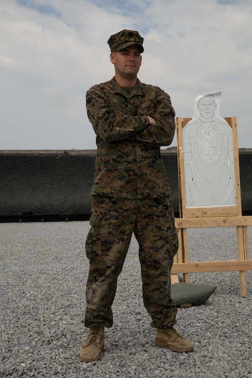 Sgt. Martin Lucero, a Denver, Colorado native, poses for a photo aboard Camp Hansen, Okinawa, Japan. Lucero traveled to Okinawa from Quantico, Virginia. to coach Marines participating in a three-gun shooting competition where Marines shot the M9 pistol, M1014 shotgun and the M16A4 service rifle. “We teach the Marines how to be more effective in combat with their standard issued weapons systems,” said Lucero. “We travel, we learn new tactics and we give that knowledge back to the Marines.” Lucero is a competitor and instructor for U.S. the Marine Corps Combat Shooting Team. (U.S. Marine Corps Photo by Cpl. Brittany A. James/ Released)