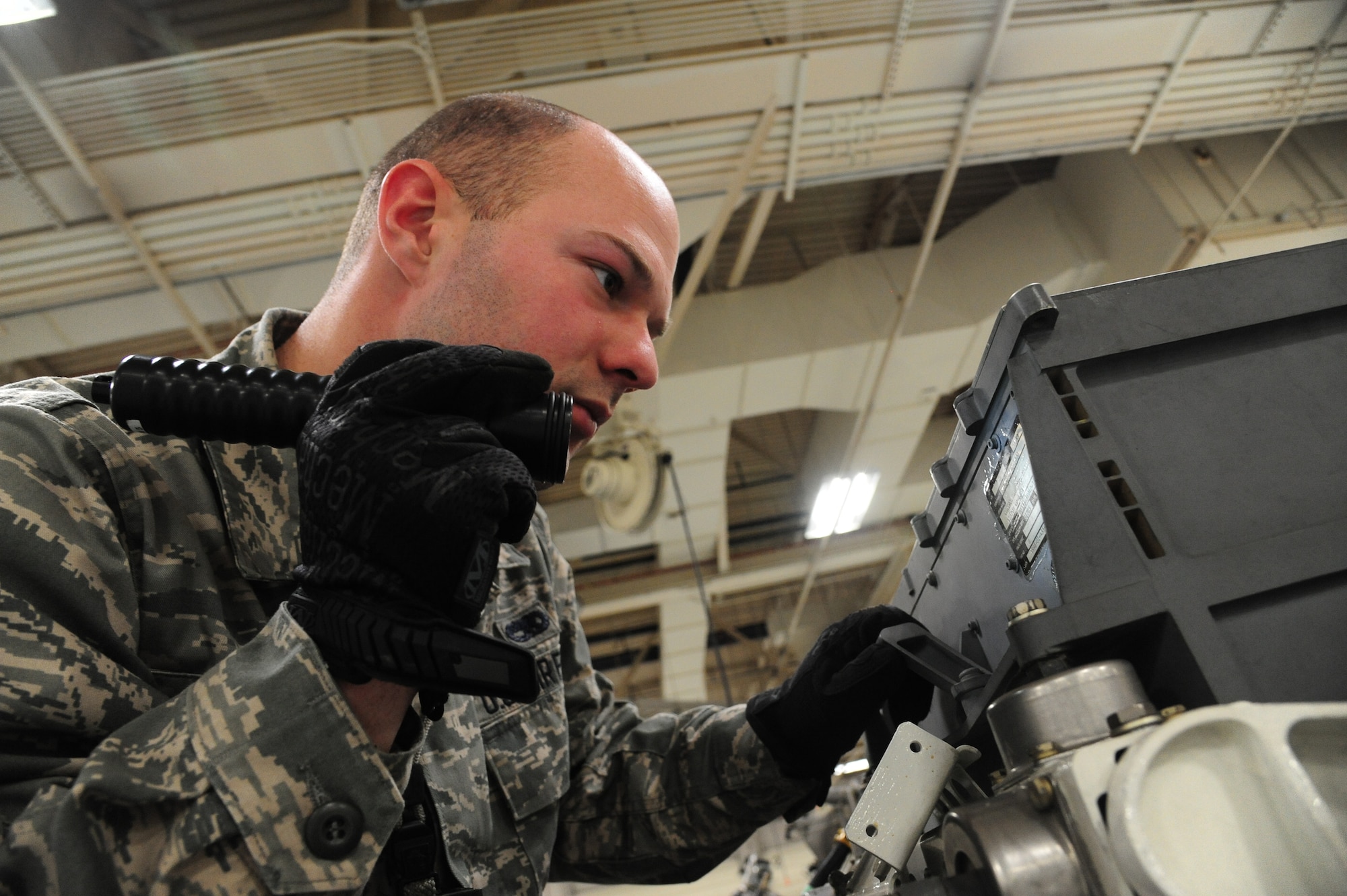 U.S. Air Force Senior Airman Nicholas McClary, a weapons specialist from the 509th Munitions Squadron, inspects and verifies data plates on a rotary launcher assembly at Whiteman Air Force Base, Mo., Feb. 12, 2016. The rotary launcher is inspected to ensure the components are compatible with the weapons system prior to being loaded. (U.S. Air Force photo by Senior Airman Keenan Berry)