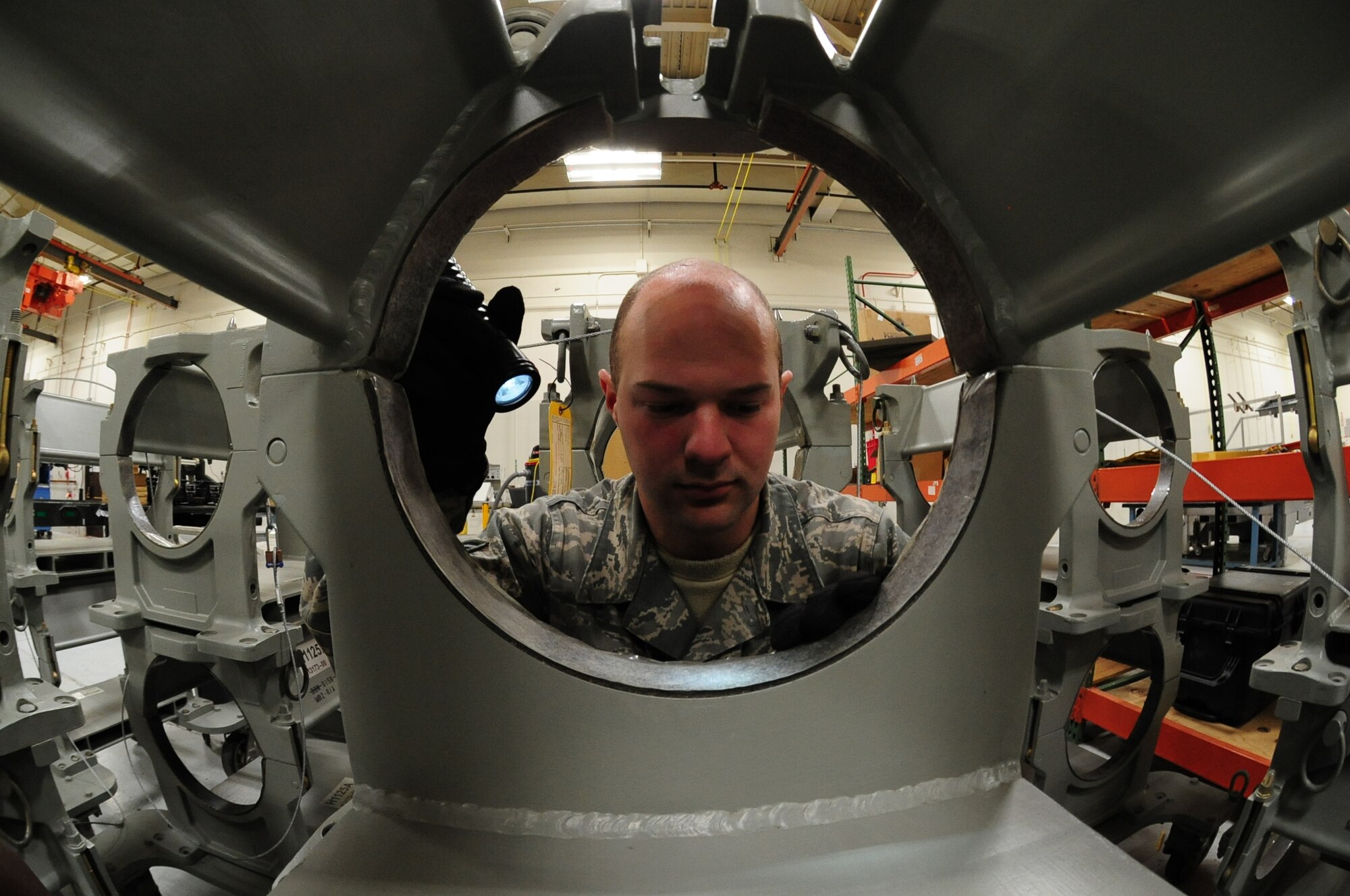U.S. Air Force Senior Airman Nicholas McClary, a weapons specialist from the 509th Munitions Squadron, performs a serviceability check on an H1125A bomb handling truck at Whiteman Air Force Base, Mo., Feb. 12, 2016. Each component of the handling gear is inspected thoroughly to ensure it’s operational before using it to install a weapon. (U.S. Air Force photo by Senior Airman Keenan Berry)