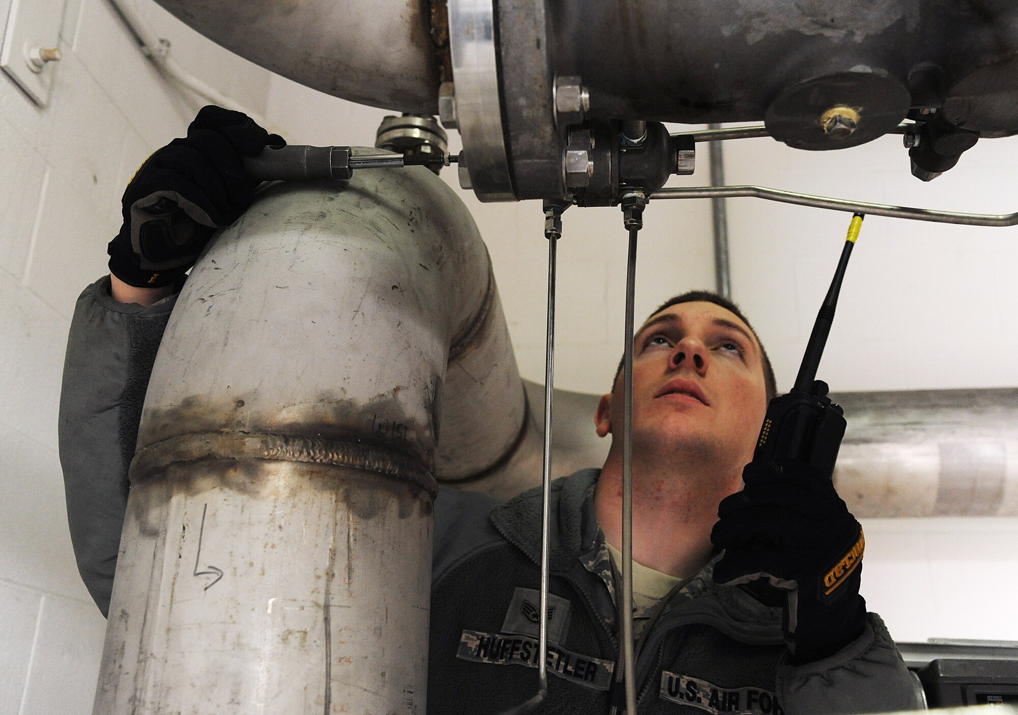 U.S. Air Force Staff Sgt. Daniel Huffstetler, the 509th Civil Engineer Squadron water and fuels systems maintenance supervisor, adjusts the rate of flow on a Type 5 fuel filter separator at Whiteman Air Force Base, Mo., Feb. 12, 2016. The Whiteman-specific Type 5 fueling system can distribute up to 4,800 gallons of fuel per minute to multiple B-2 Spirits at any given time. (U.S. Air Force photo by Airman 1st Class Michaela R. Slanchik)