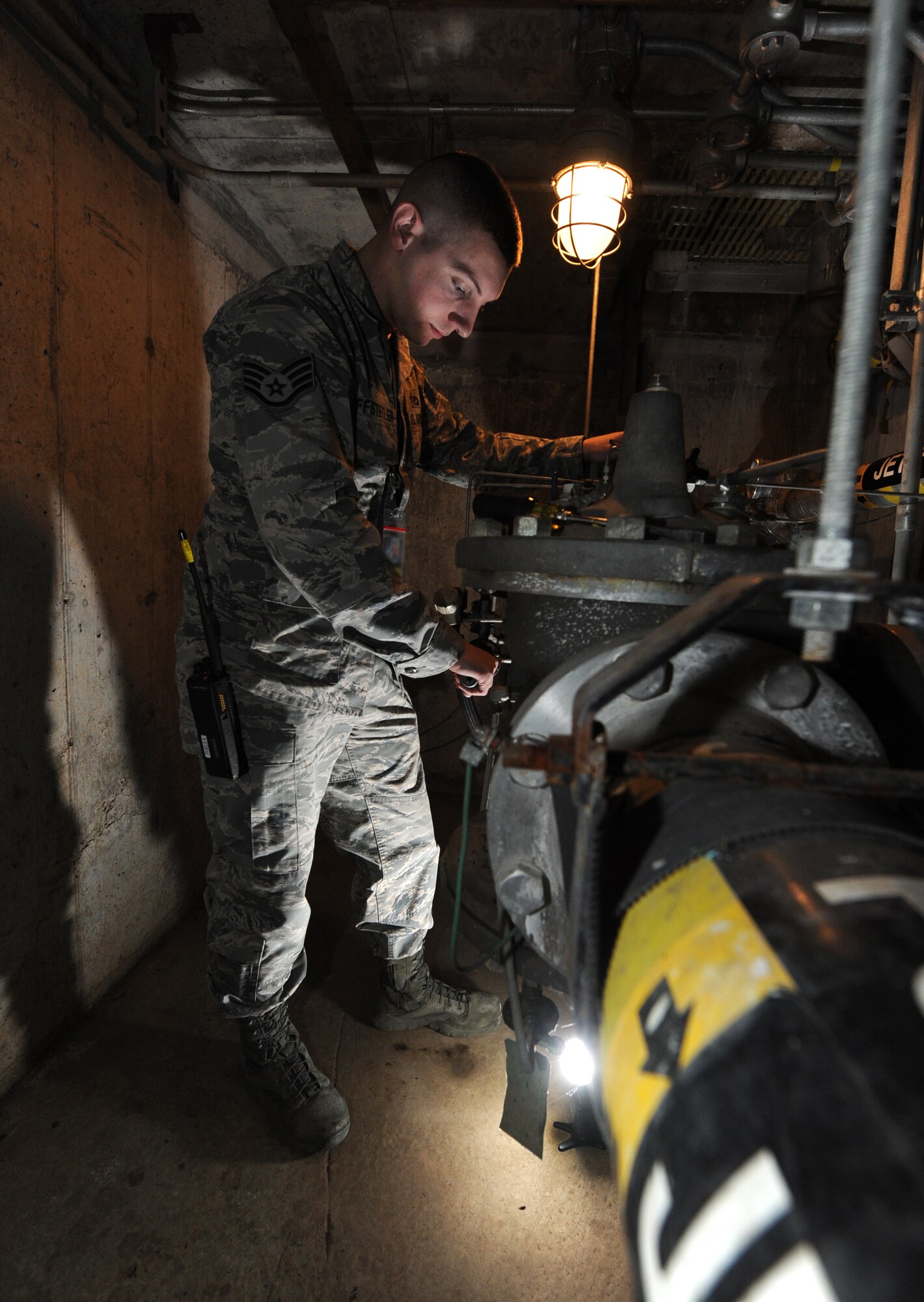U.S. Air Force Staff Sgt. Daniel Huffstetler, the 509th Civil Engineer Squadron water and fuels systems maintenance supervisor, adjusts a hydrant control valve at Whiteman Air Force Base, Mo., Feb. 12, 2016. In order to reduce fueling time from two hours to 20 minutes, the B-2 Spirit has a uniquely-designed fueling system. Huffstetler feels that the liquid fuels shop plays a critical role in the mission at Whiteman because they enable speedy fueling before takeoff, allowing bombs to be put on target on time. Huffstetler and the rest of the Liquid Fuels Maintenance section take great pride in their fuel system and people. (U.S. Air Force photo by Airman 1st Class Michaela R. Slanchik)