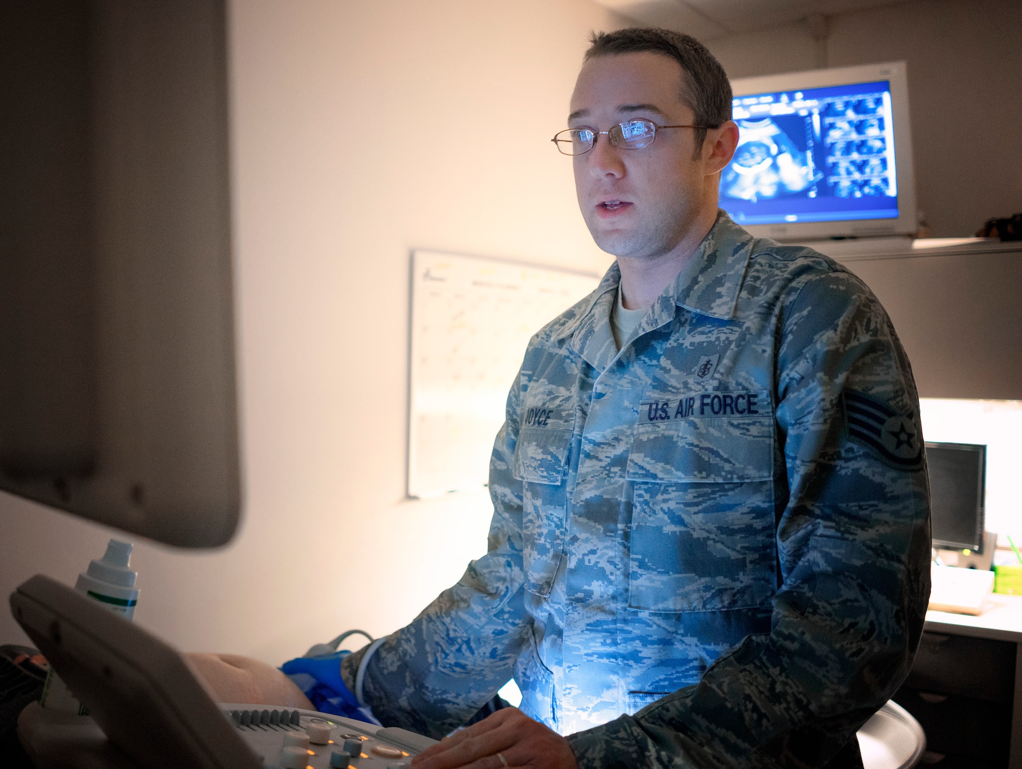 Staff Sgt. Brandon Joyce, 374th Surgical Operations Squadron surgical services NCO in charge of sonography, performs an ultrasound, Feb. 11, 2016, at Yokota Air Base, Japan. Ultrasound can be used to see internal body structures such as tendons and muscles. (U.S. Air Force photo by Airman 1st Class Delano Scott/Released)
