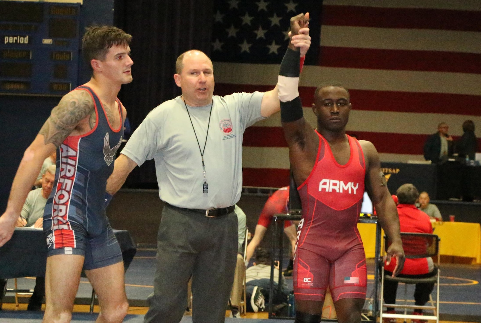 Army Spc. Ryan Mango of Fort Carson, Colo. gets his hand raised, defeating Air Force Senior Airman Tyler Knepper of RAS Lakenheath, U.K., winning the Armed Forces gold in the 61g Freestyle competition of the 2016 Armed Forces Wrestling Championship held at Naval Base Kitsap, Wash. 20-21 February 2016.  