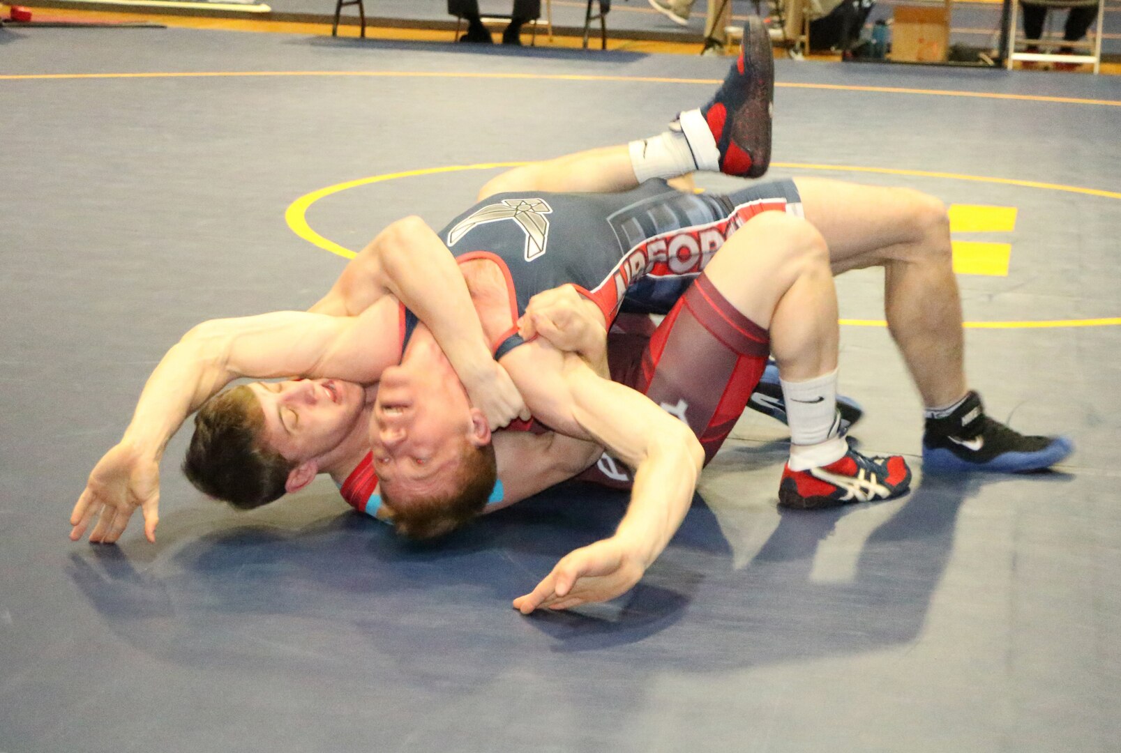 Army Pfc. Michael Hooker (red) wraps up Air Force Capt. Kurt Spranger of Wright-Patterson AFB, Ohio to win Armed Forces gold in the 65kg Freestyle competition of the 2016 Armed Forces Wrestling Championship held at Naval Base Kitsap, Wash. 20-21 February 2016.  