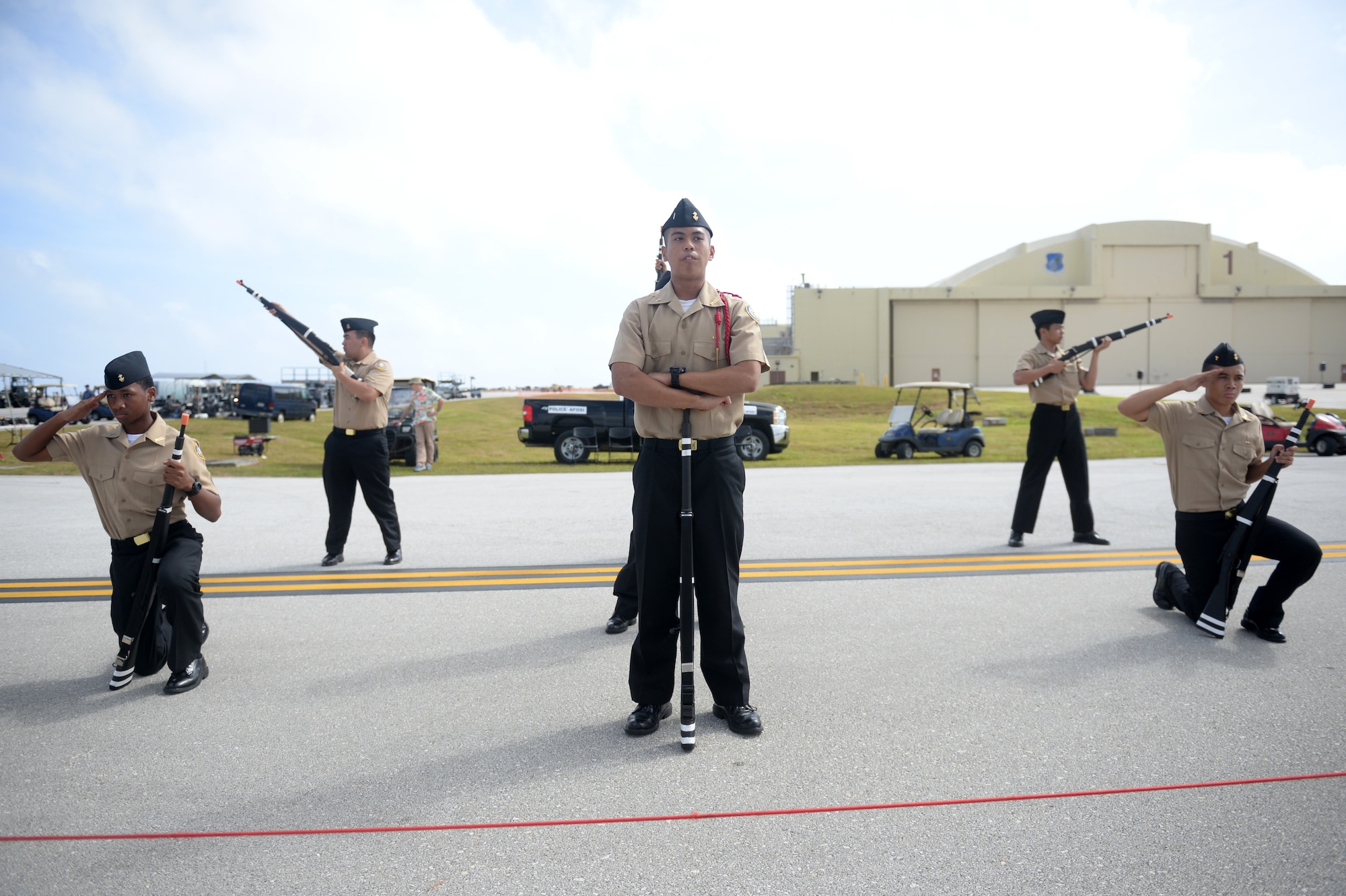 Drill members with the Guam High School Junior Reserve Officer Training Corps finish their routine Feb. 20 during the 2016 Pacific Air Partners Open House at Andersen Air Force Base, Guam.  In addition to their presentation, drill teams from Okkodo High School and John F. Kennedy High School performed for the crowd during the open house. (U.S. Air Force photo/Senior Airman Joshua Smoot)