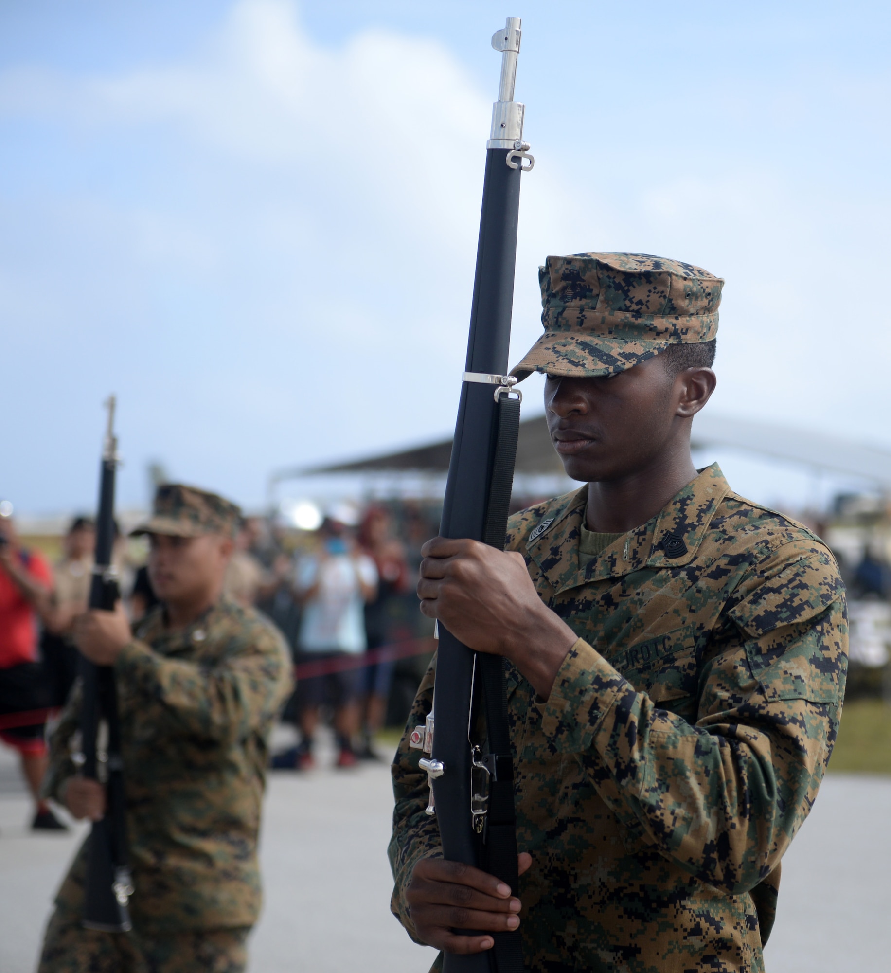 A drill member with the Okkodo High School Junior Reserve Officer Training Corps holds a rifle for a routine Feb. 20 during the 2016 Pacific Air Partners Open House at Andersen Air Force Base, Guam.  In addition to their presentation, drill teams from Guam High School and John F. Kennedy High School performed for the crowd during the open house. (U.S. Air Force photo/Senior Airman Joshua Smoot)