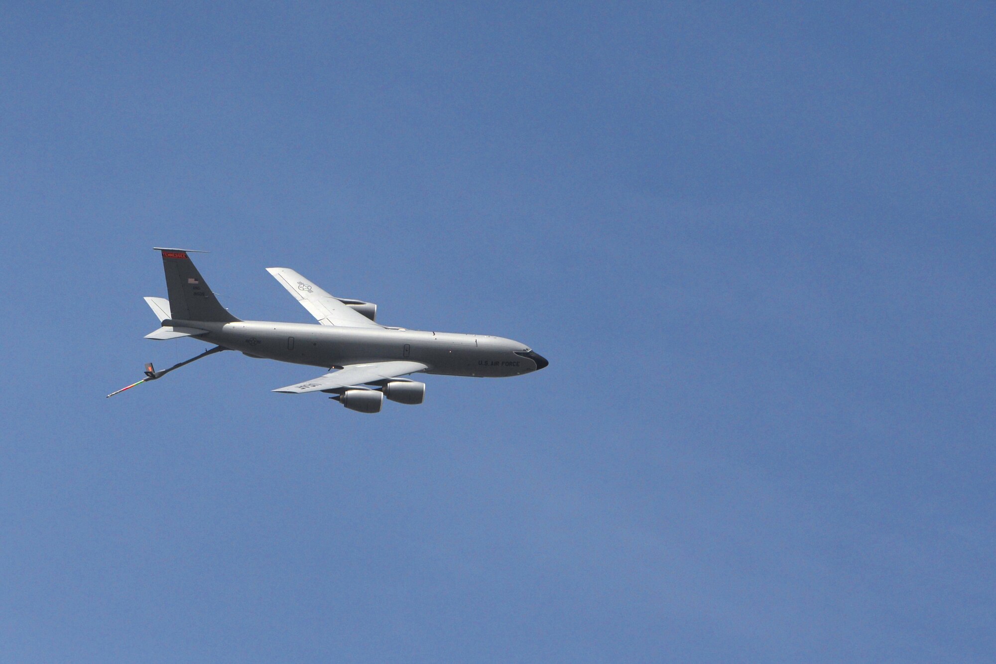 A KC-135 Stratotanker flies over the flightline during the 2016 Pacific Air Partners Open House Feb. 20 at Andersen Air Force Base, Guam. As the KC-135 flew over, the aircrew extended the boom to give attendees the opportunity to see the device that refuels other aircraft. (U.S. Air Force photo/Senior Airman Joshua Smoot)