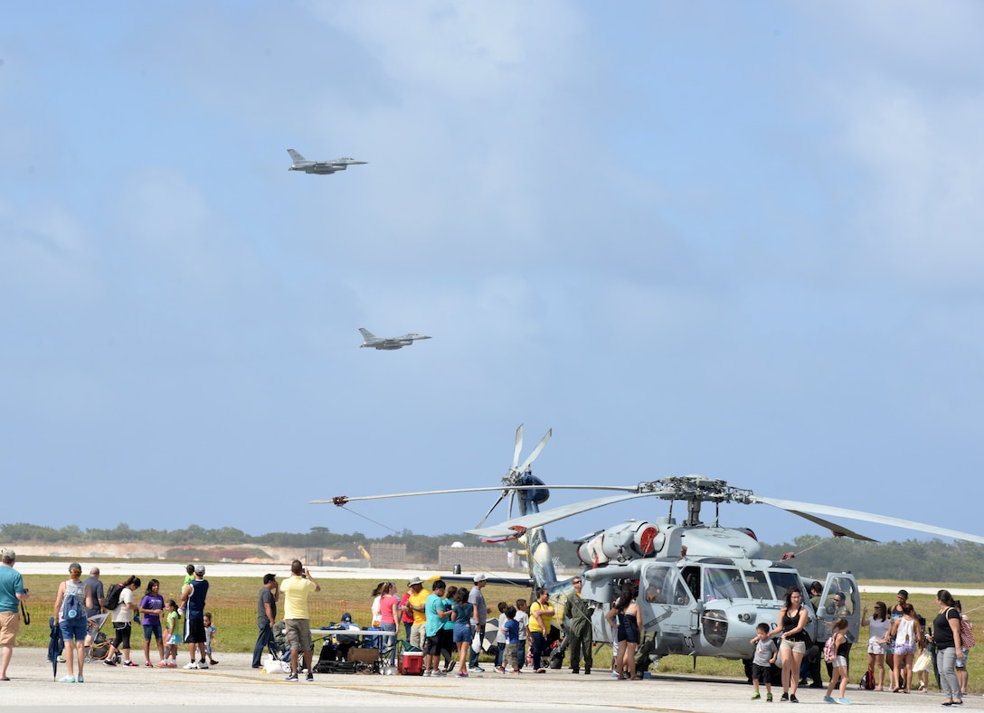 F-16 Fighting Falcons fly over the flightline Feb. 20 during the 2016 Pacific Air Partners Open House at Andersen Air Force Base, Guam.  The largest community outreach event of the year, the open house aimed to enhance public awareness of the U.S. military's mission, equipment, facilities and personnel and to promote positive community relations. (U.S. Air Force photo/Senior Airman Joshua Smoot)