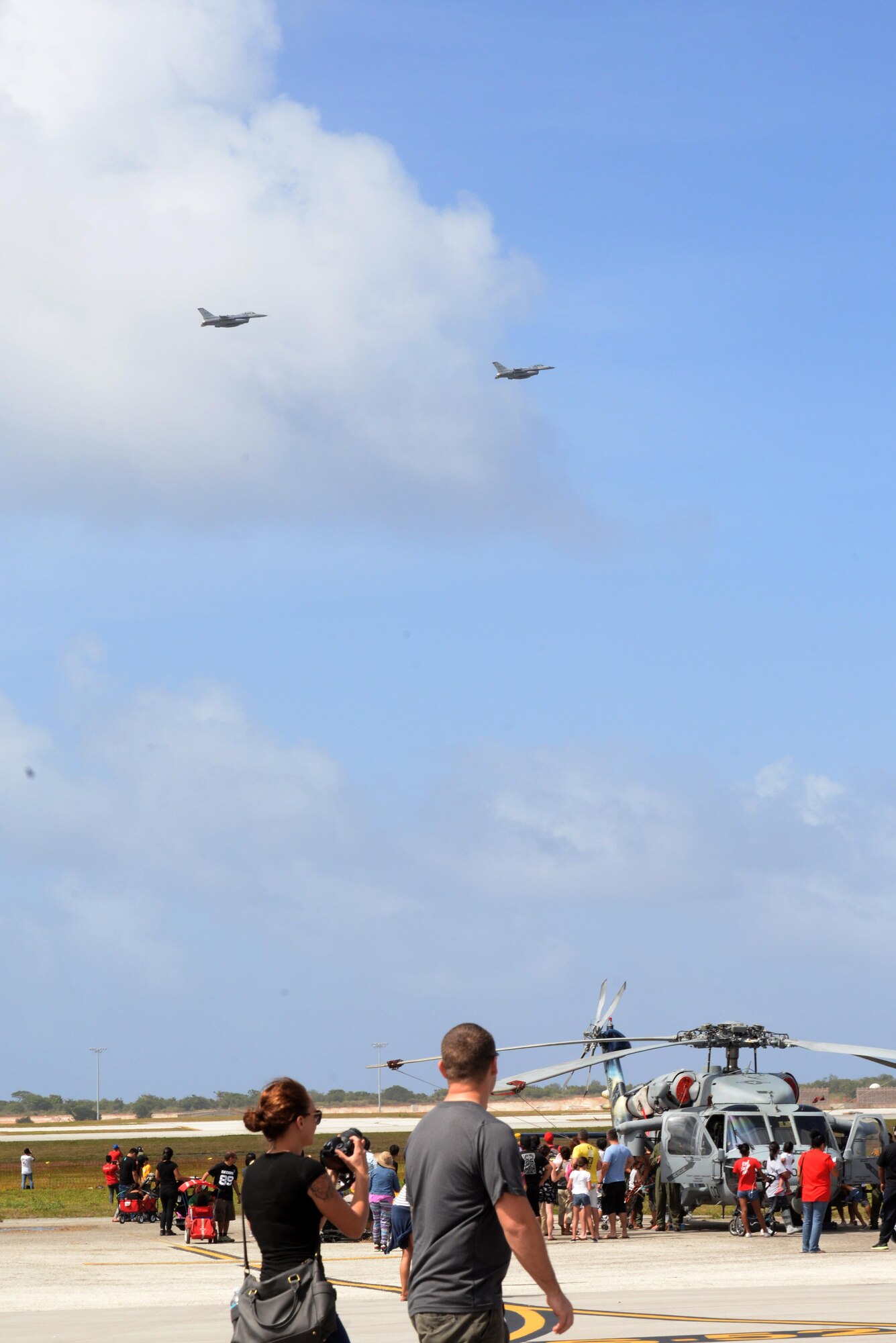 Two F-15 Eagles fly in formation during the 2016 Pacific Air Partners Open House Feb. 20 at Andersen Air Force Base, Guam. The largest community outreach event of the year, the open house aimed to enhance public awareness of the U.S. military's mission, equipment, facilities and personnel and to promote positive community relations. (U.S. Air Force Photo/Airman 1st Class Alexa Ann Henderson)