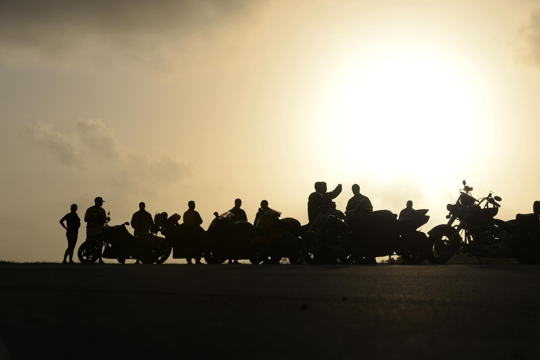 To kick-off the 2016 Pacific Air Partners Open House motorcycle enthusiasts gathered to ride down the flightline Feb. 20 at Andersen Air Force Base, Guam. The largest community outreach event of the year, the open house aims to enhance public awareness of the U.S. military's mission, equipment, facilities and personnel and to promote positive community relations. (U.S. Air Force photo/Airman 1st Class Jacob Skovo)