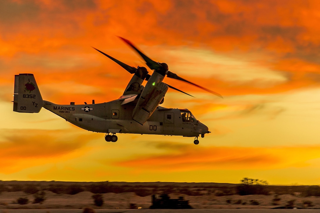 A Marine Corps MV-22 Osprey tiltrotor aircraft hovers over the desert before departing from Marine Corps Air Ground Combat Center Twentynine Palms, Calif., Feb. 15, 2016, for an Integrated Training Exercise 2-16 training mission. The Osprey crew is assigned to Marine Medium Tiltrotor Squadron 363. Air Force photo by Tech. Sgt. Efren Lopez