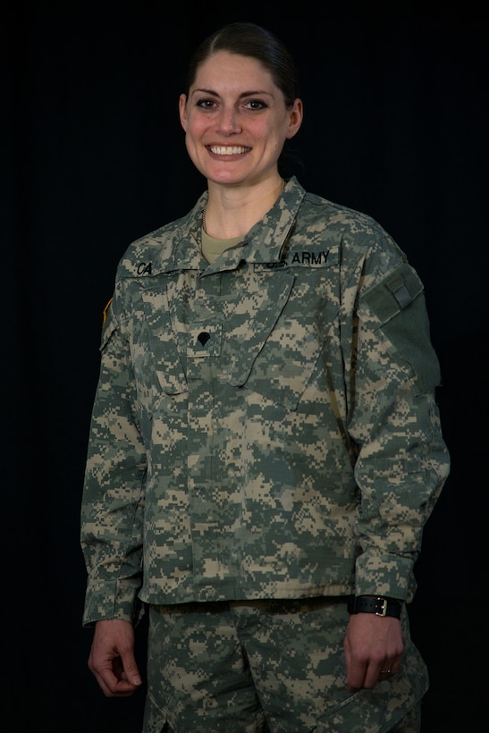 Spc. Amy Carle, a member of the California Army National Guard, displays her positive attitude during a Feb. 17, 2016, photo shoot before graduating from the Basic Public Affairs Specialist Course at the Defense Information School on Fort Meade, Md., Carle completed the 56-day course, which covers journalism, photojournalism and public affairs, on Feb. 19 as the distinguished honor graduate.