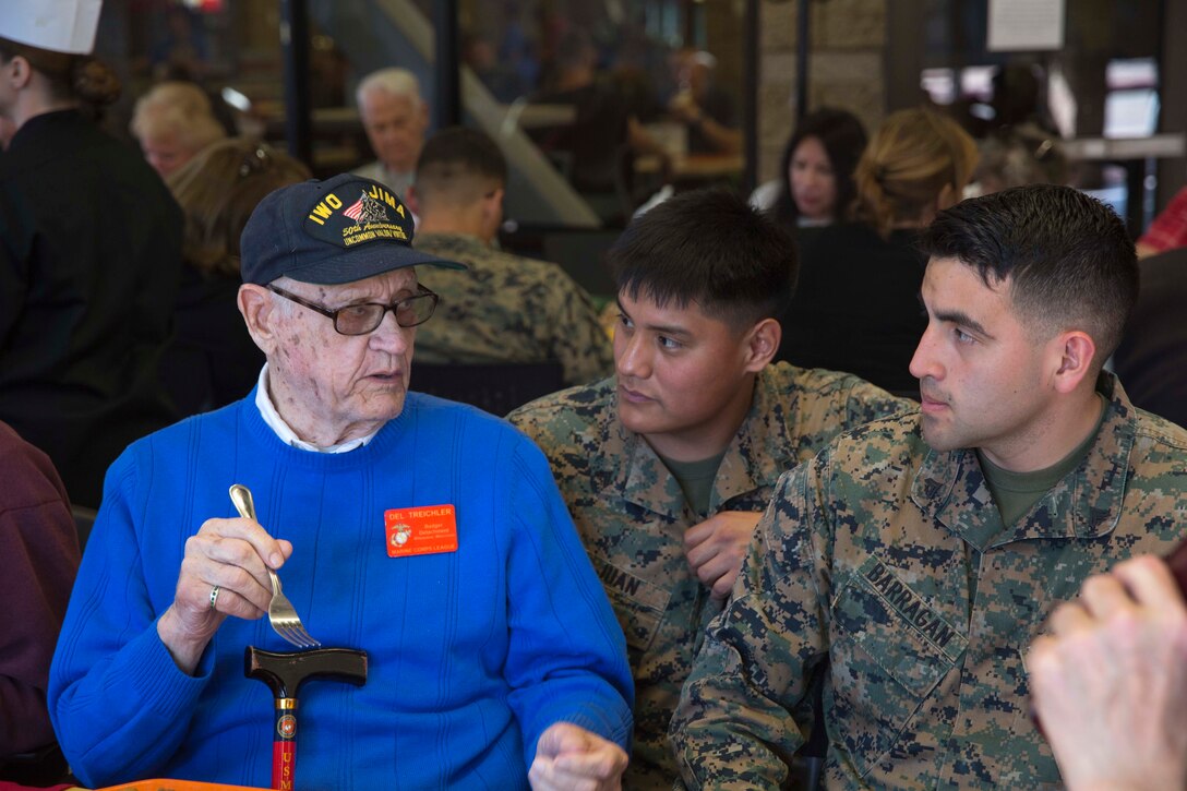 Del Treichler, left, a Battle of Iwo Jima veteran, speaks with Marines during lunch before touring Marine Corps Air Station Miramar, Calif., Feb. 19, 2016. Marine Corps photo by Sgt. Brian Marion