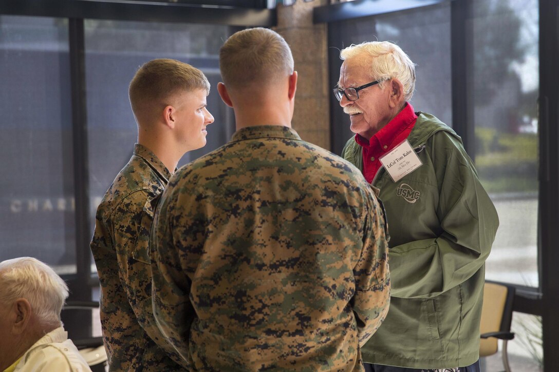 Tom Kalus, right, a Battle of Iwo Jima veteran, speaks with two Marines during a tour of Marine Corps Air Station Miramar, Calif., Feb. 19, 2016. Kalus, other Iwo Jima veterans and their families visited the air station to commemorate the 71st anniversary of the Battle of Iwo Jima. Marine Corps photo by Sgt. Brian Marion