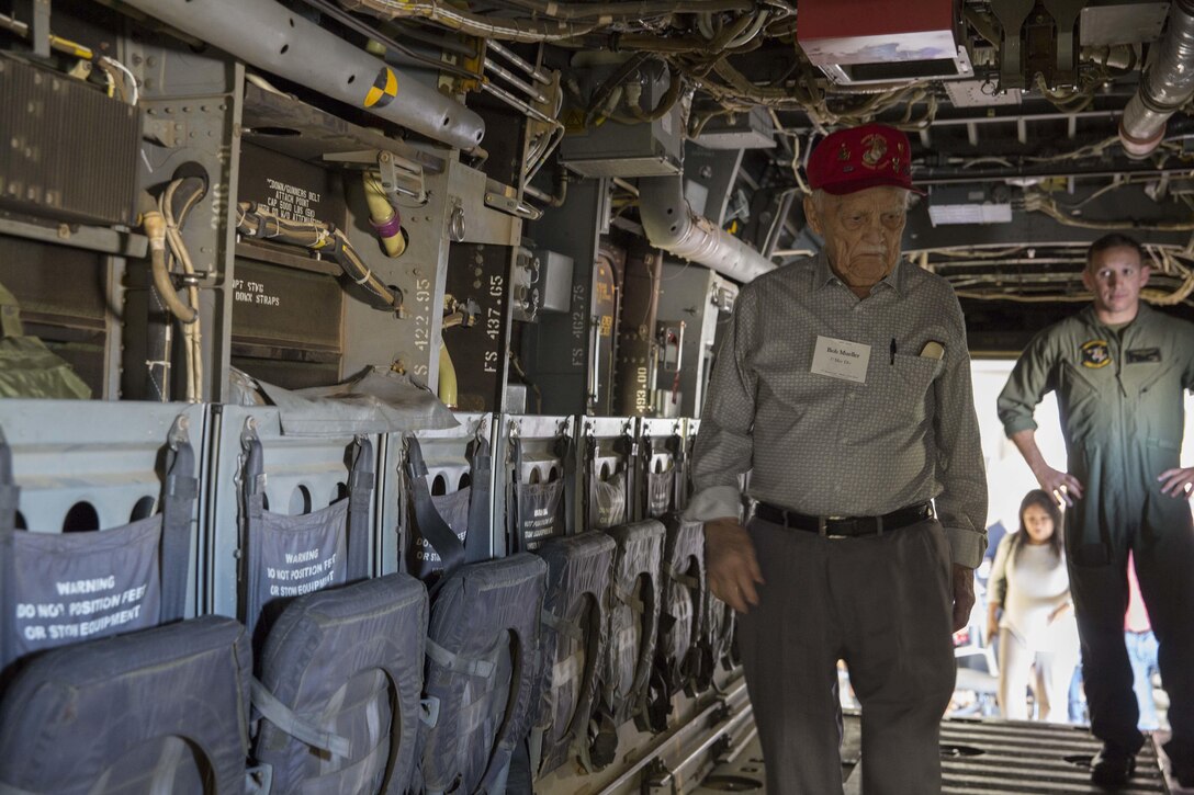 Bob Mueller, a Battle of Iwo Jima veteran, walks inside an MV-22B Osprey aircraft during a tour of Marine Medium Tiltrotor Squadron 165 on Marine Corps Air Station Miramar, Calif., Feb. 19, 2016. Marine Corps photo by Sgt. Brian Marion