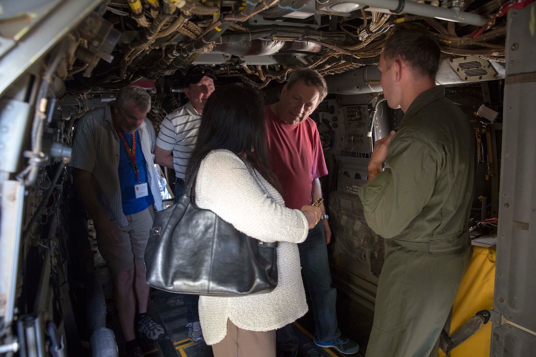 Marine Corps Capt. Evan Bernstein, right, speaks to family members of the Battle of Iwo Jima veterans during a tour on Marine Corps Air Station Miramar, Calif., Feb. 19, 2016. Bernstein is an MV-22B Osprey pilot assigned to Marine Medium Tiltrotor Squadron 165. Marine Corps photo by Sgt. Brian Marion