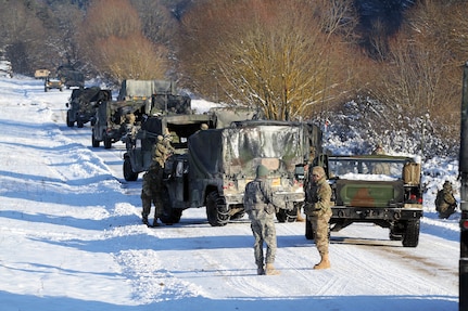 Vampire Soldiers from the Joint Multinational Readiness Center (JMRC) align vehicles in a staggered formation during a react to contact movement Jan. 22 in Allied Spirit IV, a multinational exercise at the U.S. Army’s Joint Multinational Readiness Center in Hohenfels Training Area (JMRC HTA), Germany. (U.S. Army National Guard photo by Staff Sgt. Eddie Siguenza)