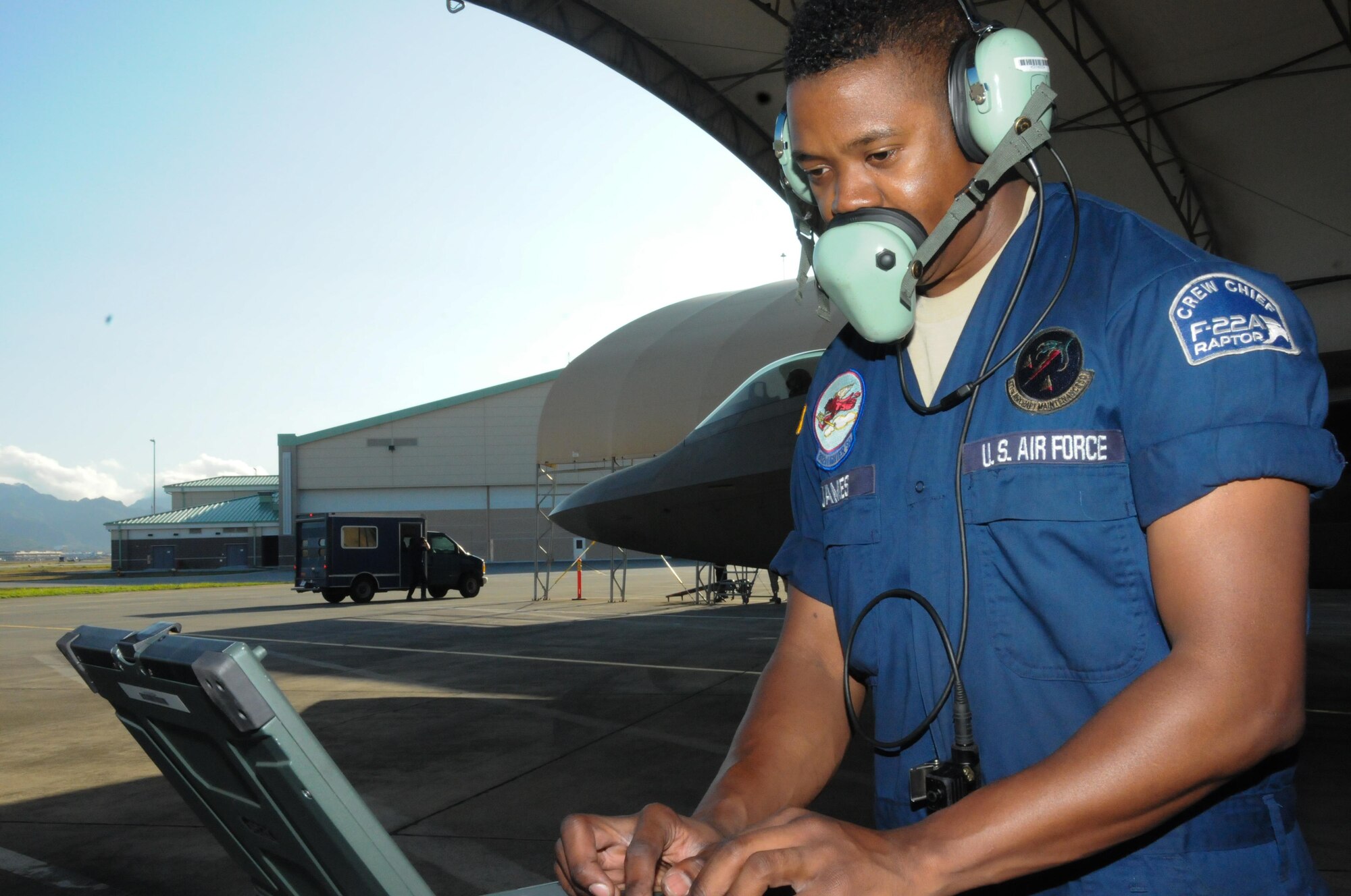 Senior Airman Jermaine James a crew chief with the 477th Maintenance Squadron based out of Alaska completes final checks prior to launching a Hawaii Air National Guard F-22 Raptor at Joint Base Pearl Harbor-Hickam, Feb. 5, 2016. While on temporary duty in Hawaii, the 477th MXS assisted 154th MXS counterparts with the maintenance of the Hawaiian Raptors. (U.S. Air National Guard photo by Senior Airman Orlando Corpuz/released)