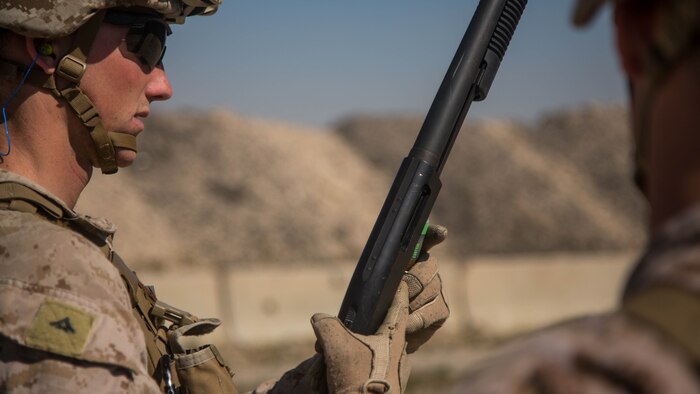 U.S. Marine Corps Lance Cpl. Kyle Durkee with Charlie Company, 1st Battalion, 7th Marine Regiment, attached to Special Purpose Marine Air-Ground Task Force-Crisis Response-Central Command (SPMAGTF-CR-CC), loads a ballistic bean bag round into a Remington M870 12-gauge pump shotgun while conducting non-lethal weapons training at an undisclosed location in Southwest Asia, Feb. 2, 2016. SPMAGTF-CR-CC Marines hone their skills in the event of non-lethal combatant operations. (