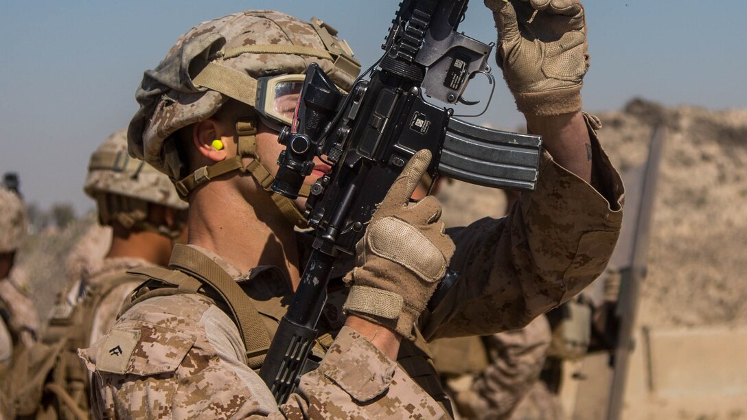 U.S. Marine Corps Lance Cpl. Tanner Walker with Charlie Company, 1st Battalion, 7th Marine Regiment, attached to Special Purpose Marine Air-Ground Task Force-Crisis Response-Central Command, loads a non-lethal round into an M203 grenade launcher as part of non-lethal weapons training at an undisclosed location in Southwest Asia, Feb. 2, 2016. SPMAGTF-CR-CC Marines hone their skills in the event of non-lethal combatant operations.