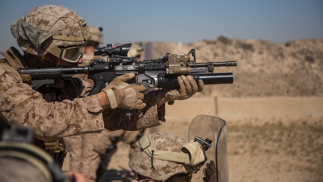 U.S. Marine Corps Lance Cpl. Tanner Walker with Charlie Company, 1st Battalion, 7th Marine Regiment, attached to Special Purpose Marine Air-Ground Task Force-Crisis Response-Central Command, fires an M203 grenade launcher as part of non-lethal weapons training at an undisclosed location in Southwest Asia, Feb. 2, 2016. SPMAGTF-CR-CC Marines hone their skills in the event of non-lethal combatant operations. 
