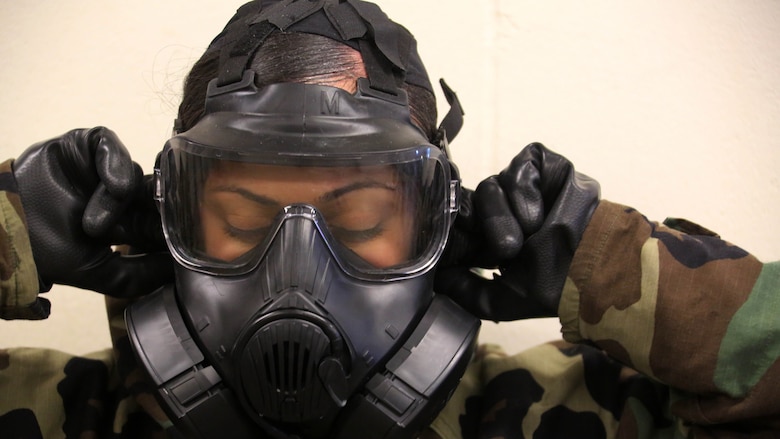 A Marine breaks the seal in her M50 Joint Service General Purpose Mask during gas chamber training at Marine Corps Air Station Cherry Point, N.C., Feb. 10, 2016. Marines with Marine Aviation Logistics Squadron 14 faced the CS gas as part of their qualification to familiarize themselves with the equipment and skills if faced with a biochemical attack. Marines of every military occupational specialty must be proficient with the equipment as it is part of every Marines’ basic skills. 