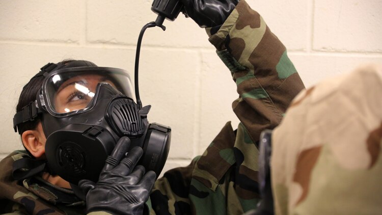 A Marine breaks the seal in her M50 Joint Service General Purpose Mask during gas chamber training at Marine Corps Air Station Cherry Point, N.C., Feb. 10, 2016. Marines with Marine Aviation Logistics Squadron 14 faced the CS gas as part of their qualification to familiarize themselves with the equipment and skills if faced with a biochemical attack. Marines of every military occupational specialty must be proficient with the equipment as it is part of every Marines’ basic skills. 