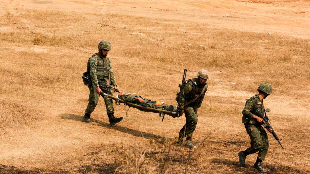 Royal Thai Marines simulate a casualty evacuation during a combined arms live fire exercise at Ban Chan Khrem, Thailand, during exercise Cobra Gold, Feb. 18, 2016. Cobra Gold is a multinational training exercise developed to strengthen security and interoperability between the Kingdom of Thailand, the U.S. and other participating nations.