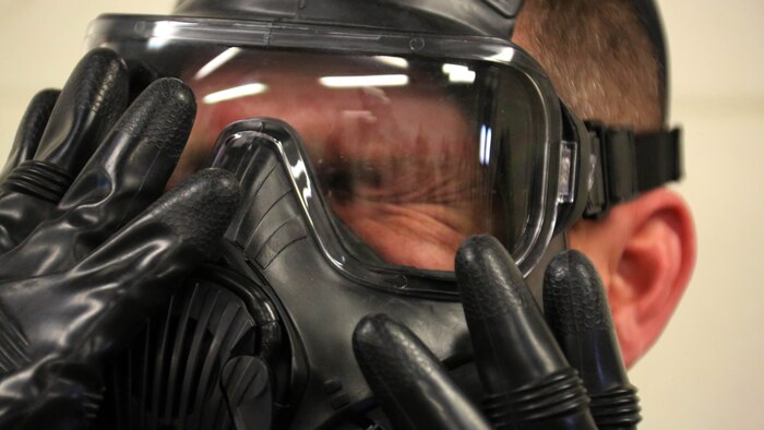 A Marine breaks the seal in his M50 Joint Service General Purpose Mask during gas chamber training at Marine Corps Air Station Cherry Point, N.C., Feb. 10, 2016. Marines with Marine Aviation Logistics Squadron 14 faced the CS gas as part of their qualification to familiarize themselves with the equipment and skills if faced with a biochemical attack. Marines of every military occupational specialty must be proficient with the equipment as it is part of every Marines’ basic skills. 