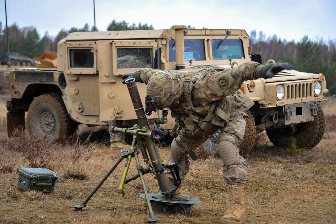 Army Spc. Danial Semenick sets up a M224 60 mm mortar system at the Drawsko Pomorskie training area, Poland, Feb. 10, 2016. Semenick is assigned to the 3rd Squadron, 2d Cavalry Regiment. Army photo by Markus Rauchenberger