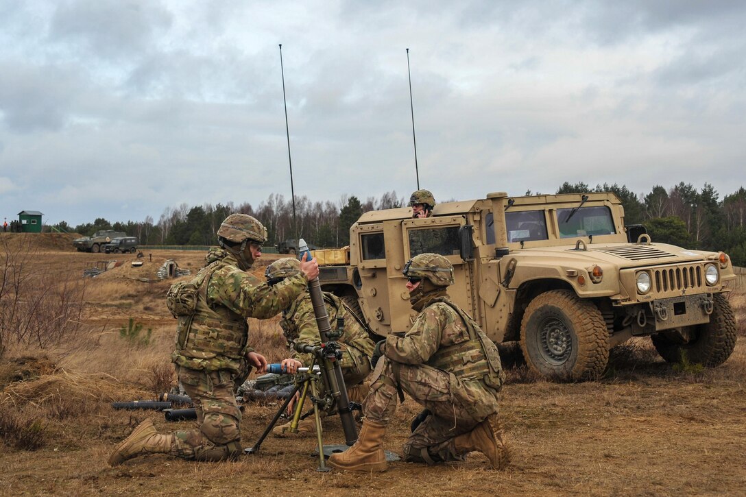 Soldiers fire a M224 60 mm mortar system simulation round on the Drawsko Pomorskie training area, Poland, Feb. 10, 2016. Army photo by Markus Rauchenberger
