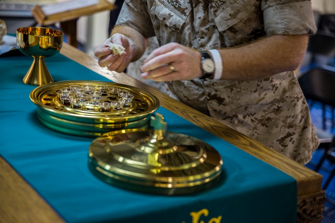 PACIFIC OCEAN (Feb. 14, 2016) – U.S. Navy Lieutenant Lloyd Wicker, a chaplain with the 13th Marine Expeditionary Unit, completes the rite of Holy Communion aboard the USS New Orleans, At Sea, Feb. 14, 2016. As their first Sunday together comes to end the religious team is looking forward to many more worship opportunities to provide mental and moral strength for service members aboard the ship. More than 4,500 Marines and Sailors with the 13th Marine Expeditionary Unit and Boxer Amphibious Ready Group are transiting the Pacific Ocean en route to the Pacific and Central command areas of responsibility.