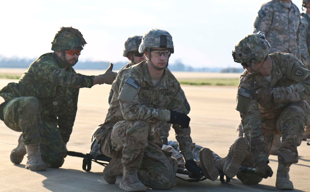 U.S. and Canadian forces conduct joint medevac training at Alexandria International Airport in Alexandria, La., before moving into a rotation at Joint Readiness Training Center on Fort Polk, La., Feb. 13, 2016. The exercise was designed to test the combined force's interoperability as well as their ability to work as brigade and task force-sized units. Army photo by Staff Sgt. Brian Ragin