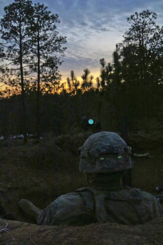 A paratrooper waits with his 60mm mortar system as night falls on Joint Readiness Training Center on Fort Polk, La., Feb. 20, 2016. Army photo by Staff Sgt. Daniel Love