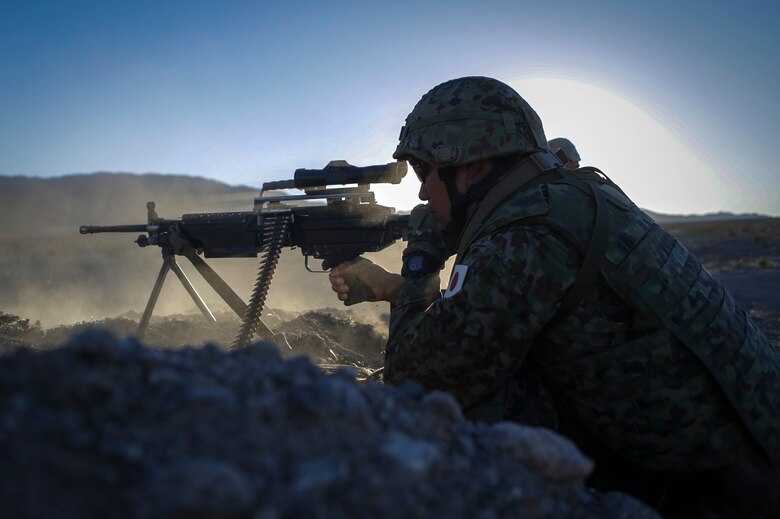 A machine gunner assigned to the Western Army Infantry Regiment, Japan Ground Self Defense Force, fires a M249 squad automatic weapon during Exercise Iron Fist 2016, aboard Marine Corps Air Ground Combat Center Twentynine Palms, Calif., Feb. 9, 2016. Iron Fist is an annual, bi-lateral training exercise between the Japan Ground Self Defense Force and Marines to strengthen warfighting capabilities in ship to shore operations.