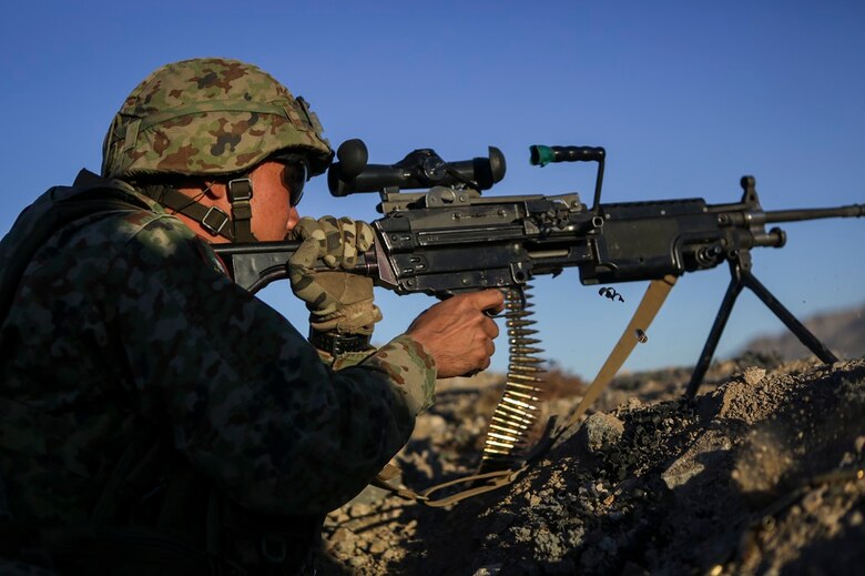 A machine gunner assigned to the Western Army Infantry Regiment, Japan Ground Self Defense Force, fires a M249 squad automatic weapon during Exercise Iron Fist 2016, aboard Marine Corps Air Ground Combat Center Twentynine Palms, Calif., Feb. 9, 2016. Iron Fist is an annual, bi-lateral training exercise between the Japan Ground Self Defense Force and Marines to strengthen warfighting capabilities in ship to shore operations.