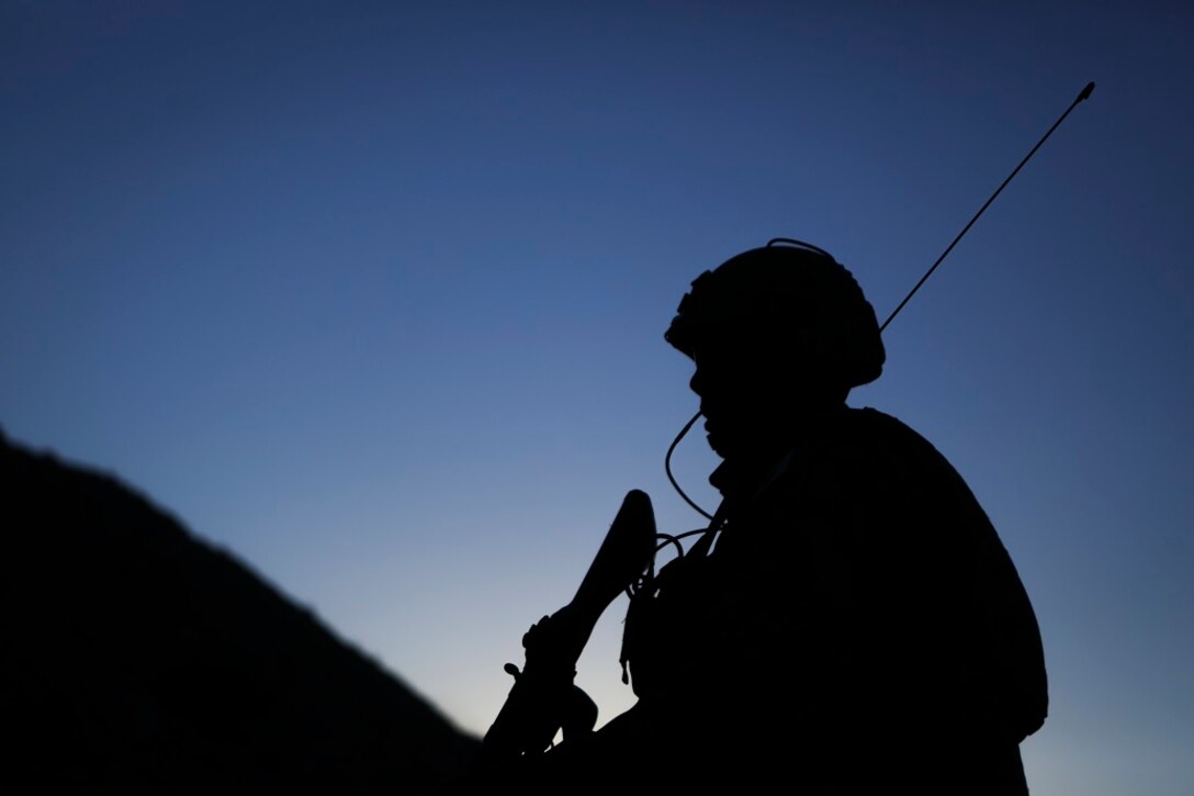 A field radio operator assigned to Western Army Infantry Regiment, Japan Ground Self Defense Force, observes the impact area, during a live-fire platoon level assault, during Exercise Iron Fist 2016, aboard Marine Corps Air Ground Combat Center Twentynine Palms, Feb. 9, 2016. Iron Fist is an annual, bi-lateral training exercise between the Japan Ground Self Defense Force and Marines to strengthen warfighting capabilities in ship to shore operations.