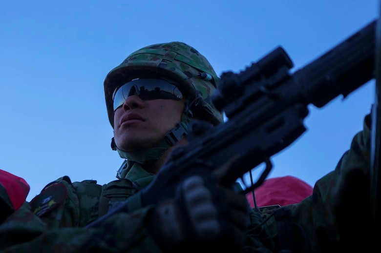 A rifleman assigned to Western Army Infantry Regiment, Japan Ground Self Defense Force, provides security from an amphibious assault vehicle, during a live-fire platoon level assault, during Exercise Iron Fist 2016 aboard Marine Corps Air Ground Combat Center Twentynine Palms, Feb. 9, 2016. Iron Fist is an annual bilateral training exercise between the Japan Ground Self Defense Force and Marines to strengthen warfighting capabilities in ship to shore operations.