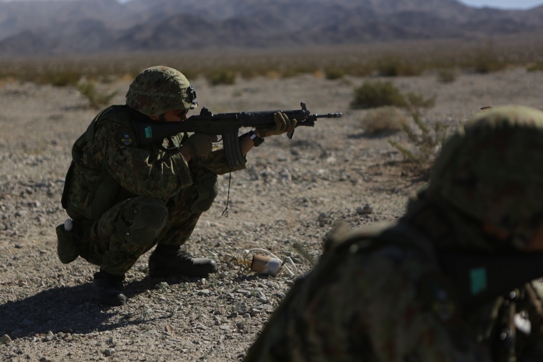 A rifleman assigned to the Western Army Infantry Regiment, Japan Ground Self Defense Force, fires on simulated targets, during a live-fire platoon level assault during Exercise Iron Fist 2016 aboard Marine Corps Air Ground Combat Center Twentynine Palms, Feb. 9, 2016. Iron Fist is an annual, bi-lateral training exercise between the Japan Ground Self Defense Force and Marines to strengthen warfighting capabilities in ship to shore operations.