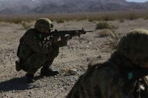 A rifleman assigned to the Western Army Infantry Regiment, Japan Ground Self Defense Force, fires on simulated targets, during a live-fire platoon level assault during Exercise Iron Fist 2016 aboard Marine Corps Air Ground Combat Center Twentynine Palms, Feb. 9, 2016. Iron Fist is an annual, bi-lateral training exercise between the Japan Ground Self Defense Force and Marines to strengthen warfighting capabilities in ship to shore operations.